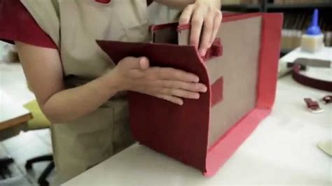 person making leather handbags